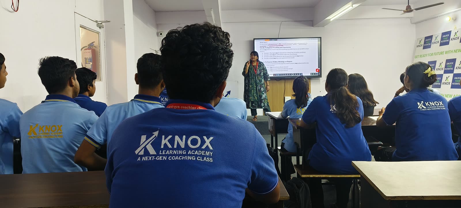 A Knox teacher taking a class at the smart board